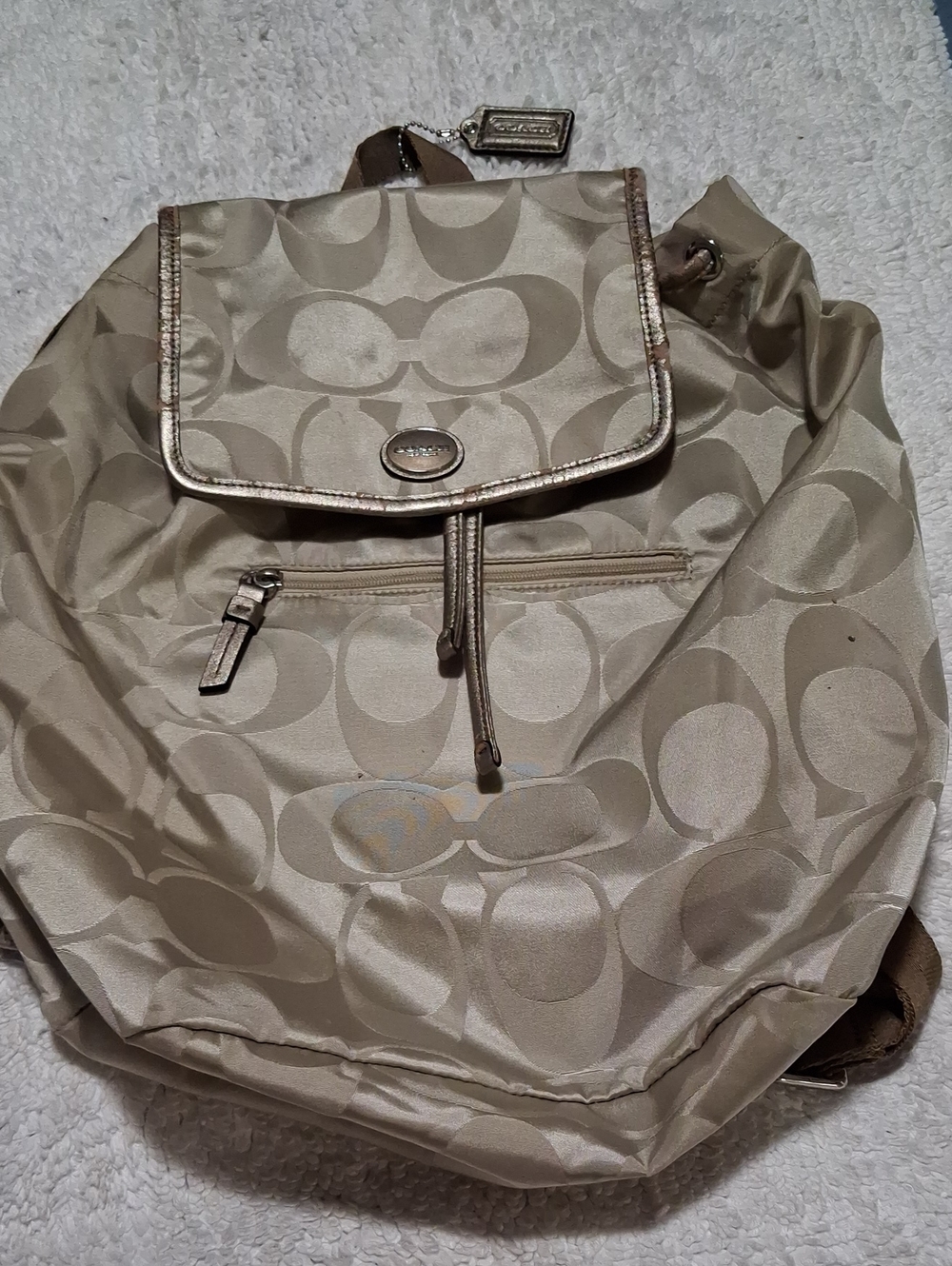 Coach Signature Logo Drawstring Backpack in Beige and Metallic Trim